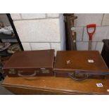 Two leather briefcases (locks but no keys - are of standard type).