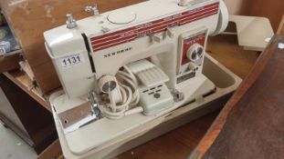 A boxed New Home sewing machine