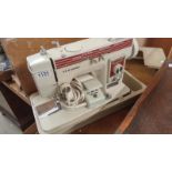 A boxed New Home sewing machine