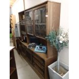 An oak cabinet with leaded glass