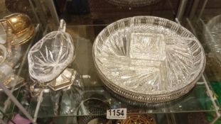 A cut glass nut dish on silver plate stand and 1 other