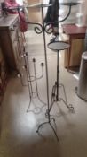 2 metal large candlesticks and 1 other