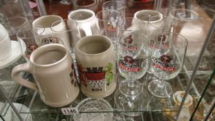 A quantity of china beer mugs and glasses