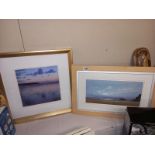 A pair of prints of beach scenes