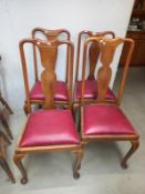 A set of four mid 20th century dining chairs with red seats, COLLECT ONLY.