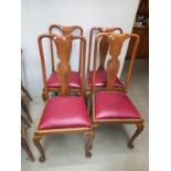 A set of four mid 20th century dining chairs with red seats, COLLECT ONLY.