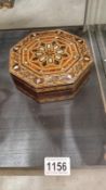 An octagonal marquetry inlaid box