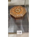 An octagonal marquetry inlaid box