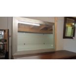 A bevel edged Manhattan framed mirror. 109cm x 79cm