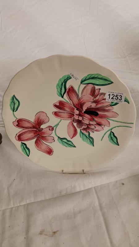 A Clarice Cliff hand painted orchid plate.