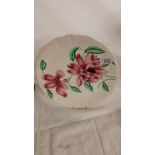 A Clarice Cliff hand painted orchid plate.