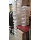 Three 6 drawer plastic storage units, one with wheels. (1 drawer handle A/F, 1 wheel repairable).