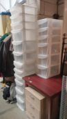 Three 6 drawer plastic storage units, one with wheels. (1 drawer handle A/F, 1 wheel repairable).