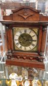 A wooden mantel clock. A/F