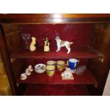 A mixed lot of china cats, dogs, salt and pepper pots etc.,