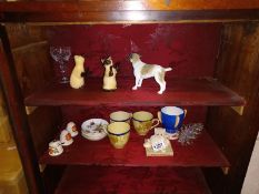 A mixed lot of china cats, dogs, salt and pepper pots etc.,