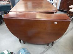 A dark wood drop leaf table. COLLECT ONLY.