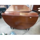 A dark wood drop leaf table. COLLECT ONLY.