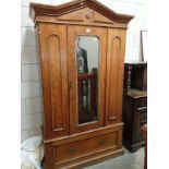 A teak double wardrobe with large drawer