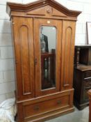 A teak double wardrobe with large drawer
