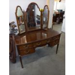 A dark wood dressing table with mirror. COLLECT ONLY.