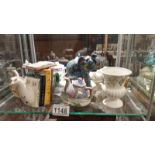 A quantity of cabinet miniature teapots etc