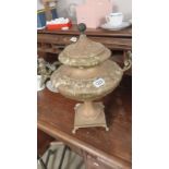 An old copper tea urn
