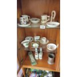 An interesting collection of items including pottery cups, clock, etc