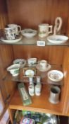 An interesting collection of items including pottery cups, clock, etc