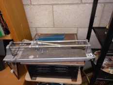 A 10" diamond saw tile cutter.