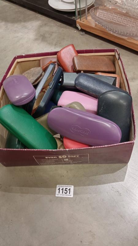 A box of glasses, sun glasses and some vintage plus cases