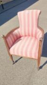 A lovely pink stripped brass wheeled chair