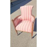 A lovely pink stripped brass wheeled chair