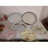 Two large meat platters and plates.