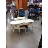 A mid 20th century dressing table with stool