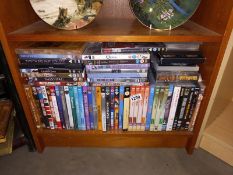 A quantity of DVD's, classic British comedy, Blockbusters etc.,