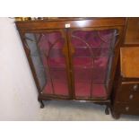 A mid 20th century display unit with glass doors. COLLECT ONLY.