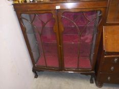 A mid 20th century display unit with glass doors. COLLECT ONLY.