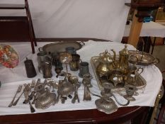A large lot of silver plate including teaset, coffee pots etc.,