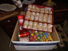 A box of Christmas crackers & party poppers etc.