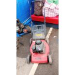 A Briggs & Stratton working petrol mower with grass box. Collect Only.