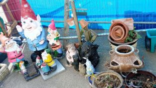 A quantity of garden gnomes & pots etc. Collect Only.