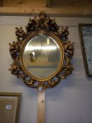 A heavy gilt framed circular mirror, COLLECT ONLY.