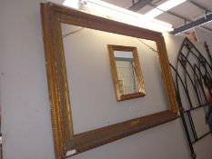 A large decorative picture frame, 120cm x 90cm and a small mirror. Collect Only.