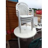 A white plastic garden set of round table & 4 chairs (table diameter 98cm). Collect Only.