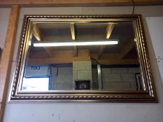 A gilt framed bevel edged mirror. COLLECT ONLY. 108cm x 77cm