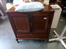 A modern solid wood TV cabinet. Opening doors over drop down front. Collect Only.