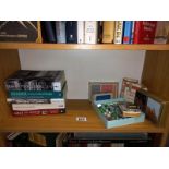 A selection of playing cards and a box of marbles.