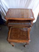 A nest of 3 carved tables with glass inserts. Collect Only.