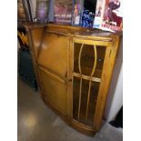 A bow front glazed writing desk with lockable doors/ key. Collect Only.